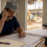 General contractor managing construction project outdoors