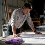 Project manager reviewing construction contracts
