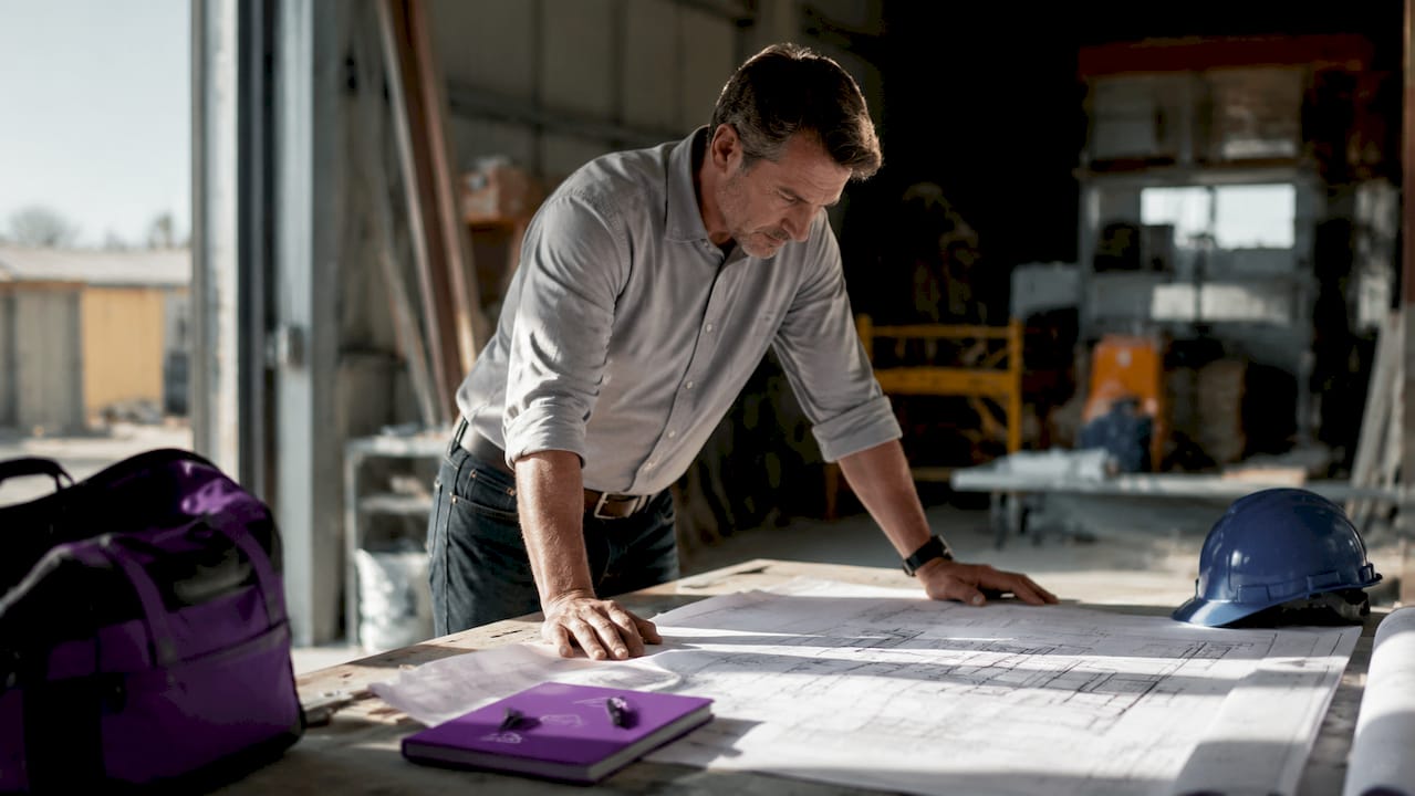Project manager reviewing construction contracts