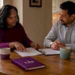 Homeowner consulting licensed contractor indoors
