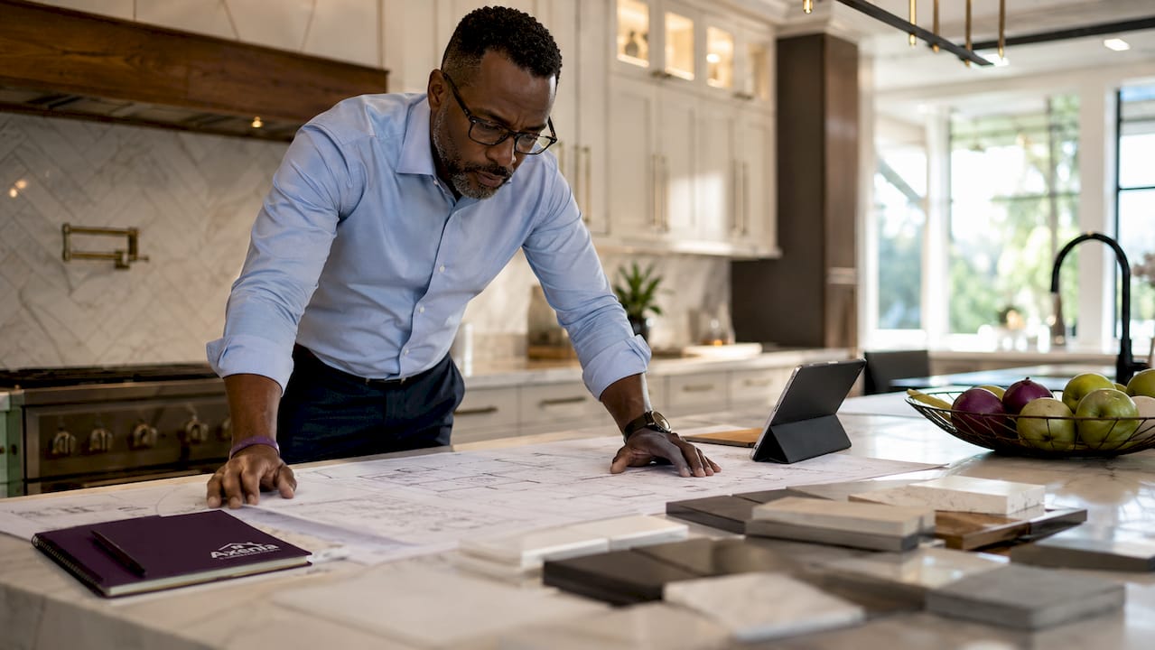 Design-build contractor studying blueprints