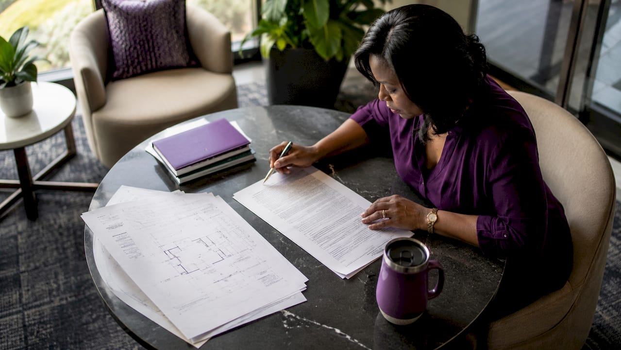Project manager reviewing subcontractor agreements
