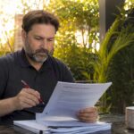 Property owner reviewing construction warranty document