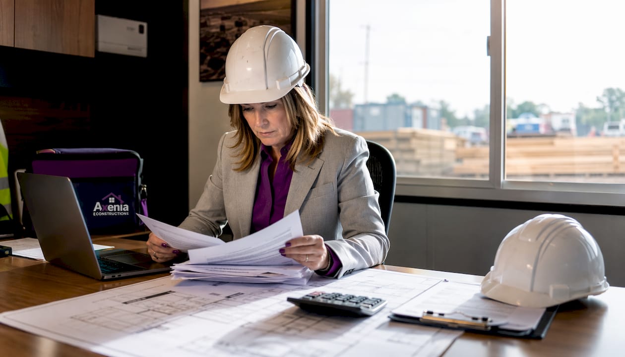 Project manager reviewing bonding papers onsite