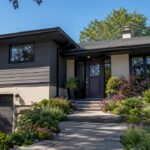 Split-level home exterior with contrasting paint and front entry