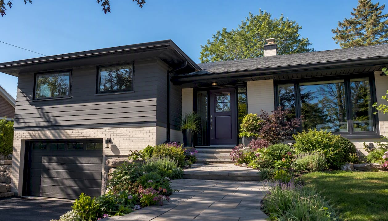 Split-level home exterior with contrasting paint and front entry