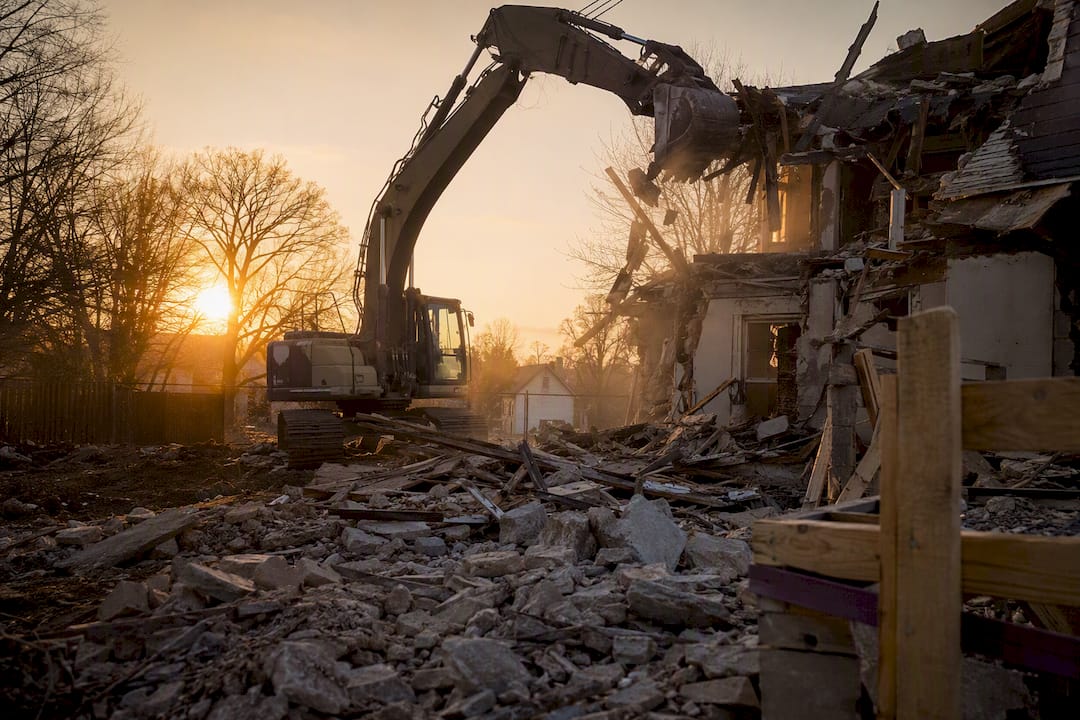 Residential demolition site with excavators in action