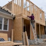 Two-story addition framing beside a Maryland home