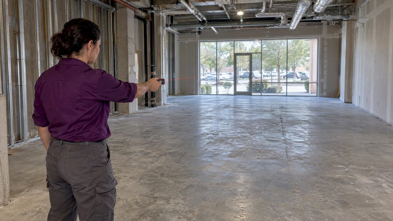 Estimator measuring a vacant retail unit