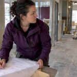 Project manager reviewing a construction budget on site