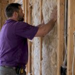 Insulation fitted between exposed wall studs