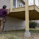 Attached deck framing beside an Arlington home